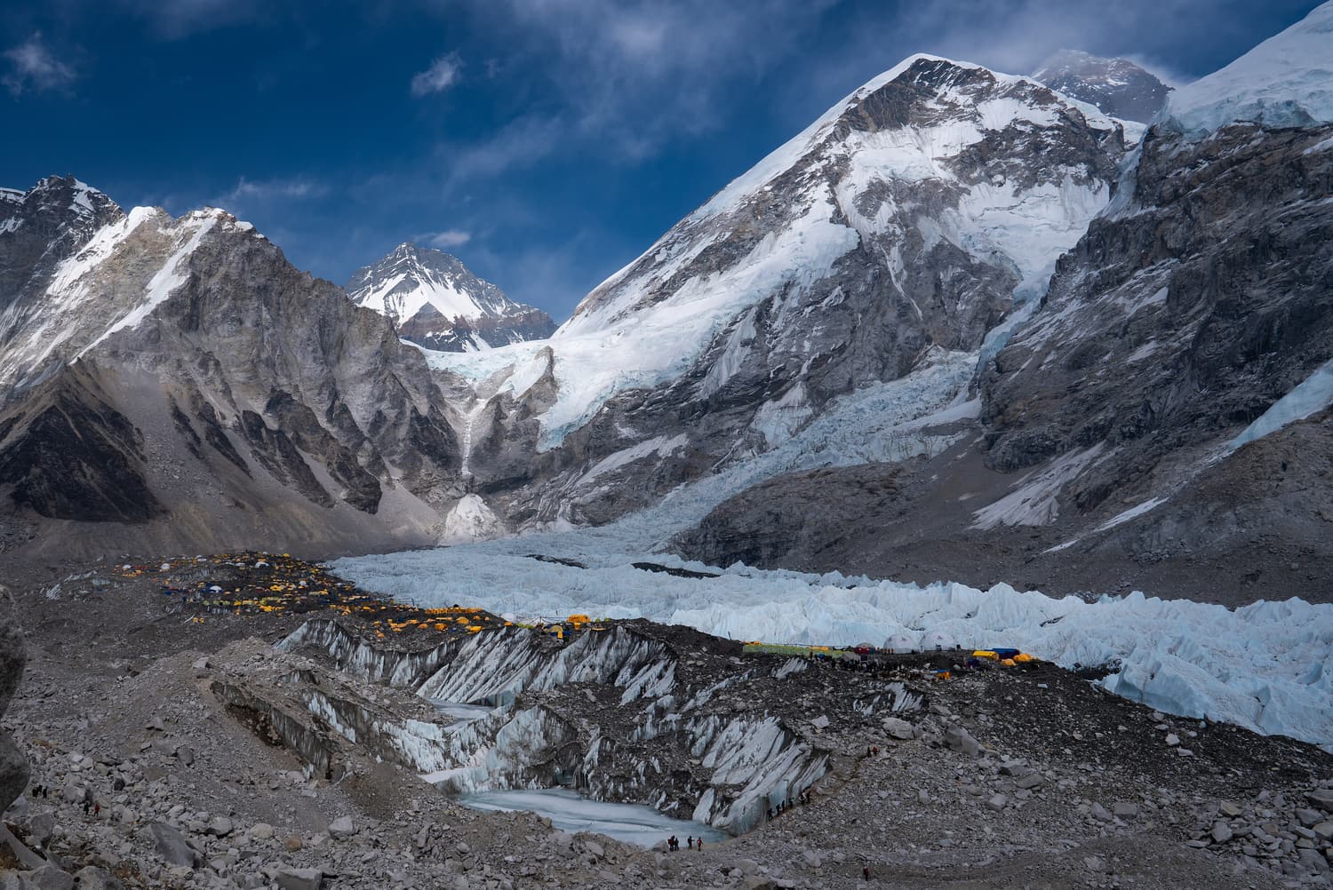 Tents of Everest Base Camp scattered on the Khumbu Glacier beneath the Icefall