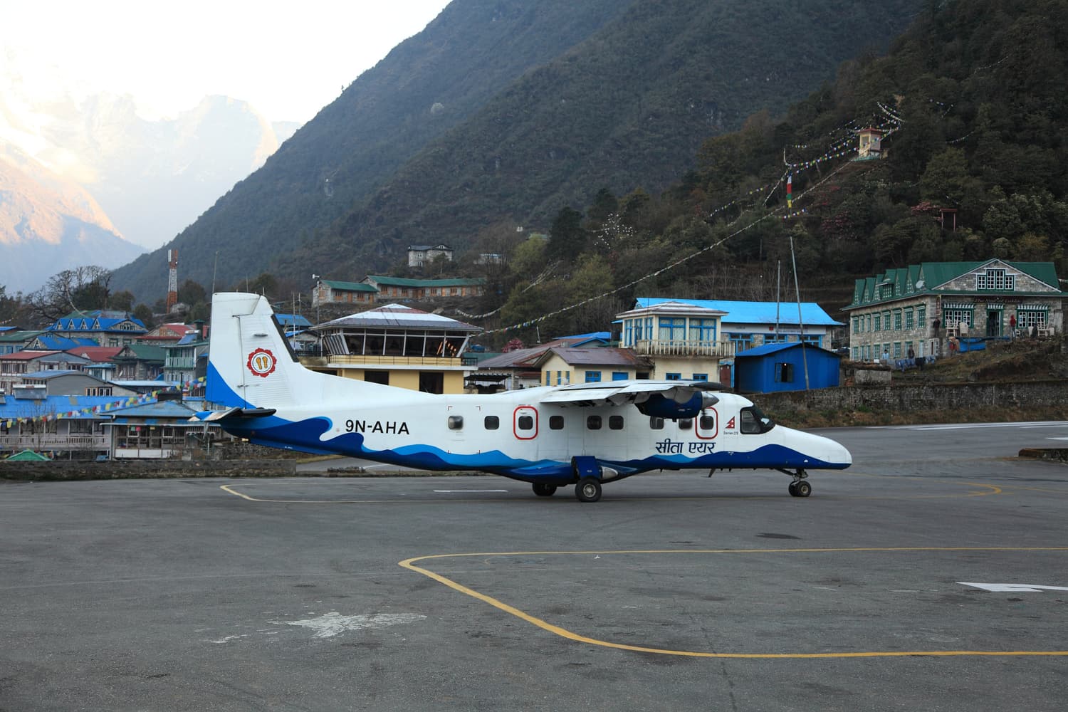 A small Dornier aircraft on the apron at Tenzing-Hillary Airport in Lukla