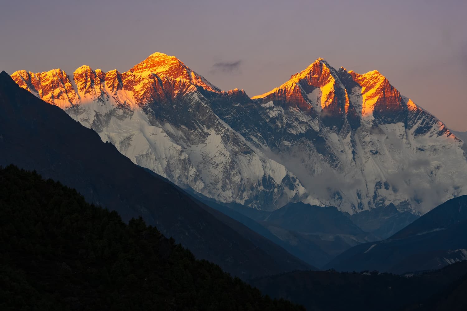 Everest, Lhotse and Nuptse glowing orange at sunset
