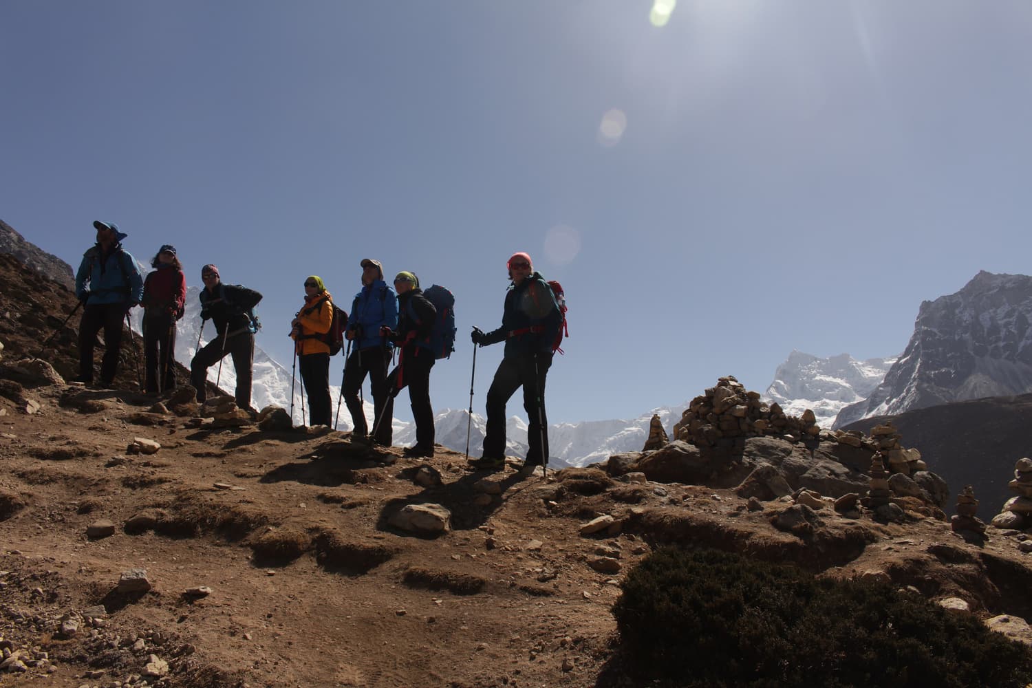 A group of trekkers silhouetted on a ridge on the way to Everest Base Camp